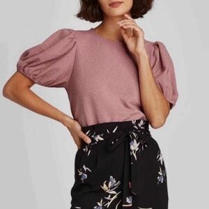 A New Day Puff sleeve blouse in a dusty rose color.